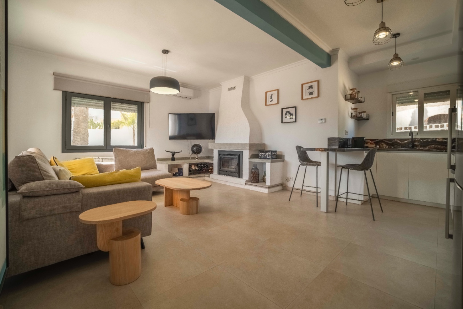 Open-plan lounge and kitchen at renovated villa in Calpe