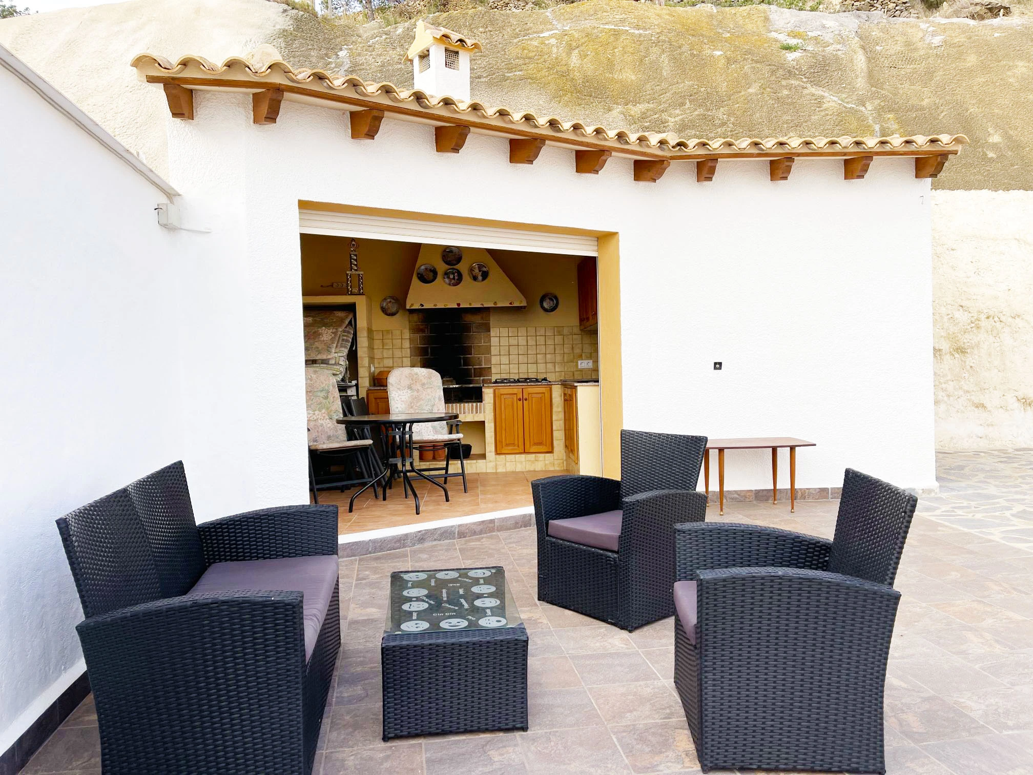 Outdoor kitchen and seating area at detached villa in Calpe