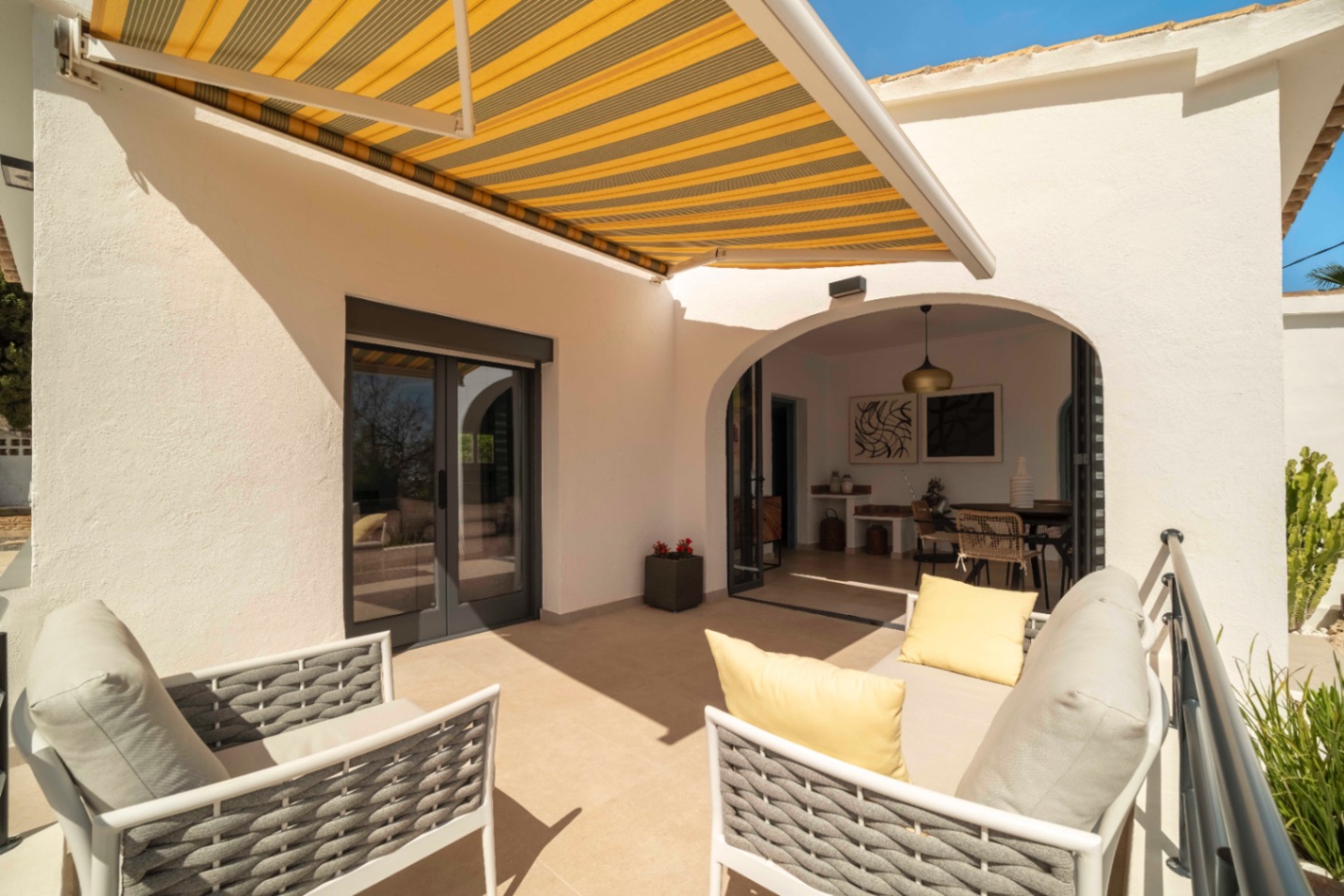 Outdoor lounge terrace at renovated Ibiza-style villa in Calpe
