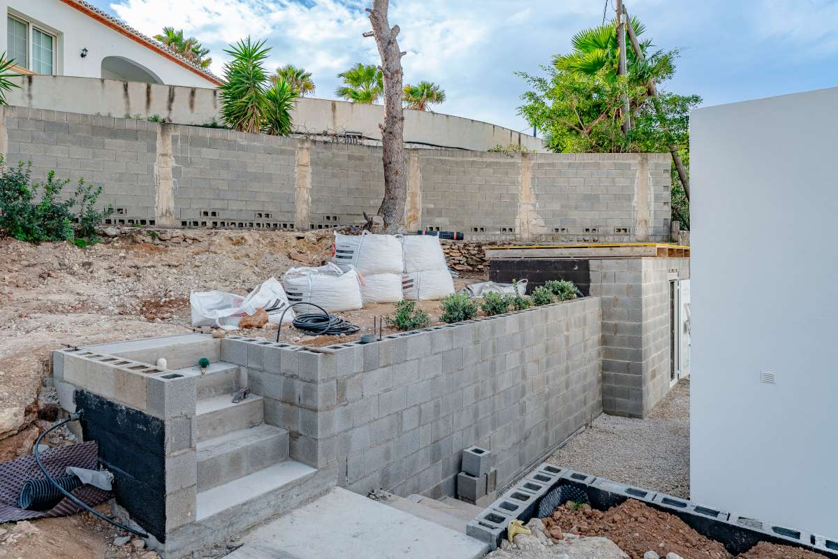 Outdoor steps and garden area beside a modern new build villa for sale in Calpe