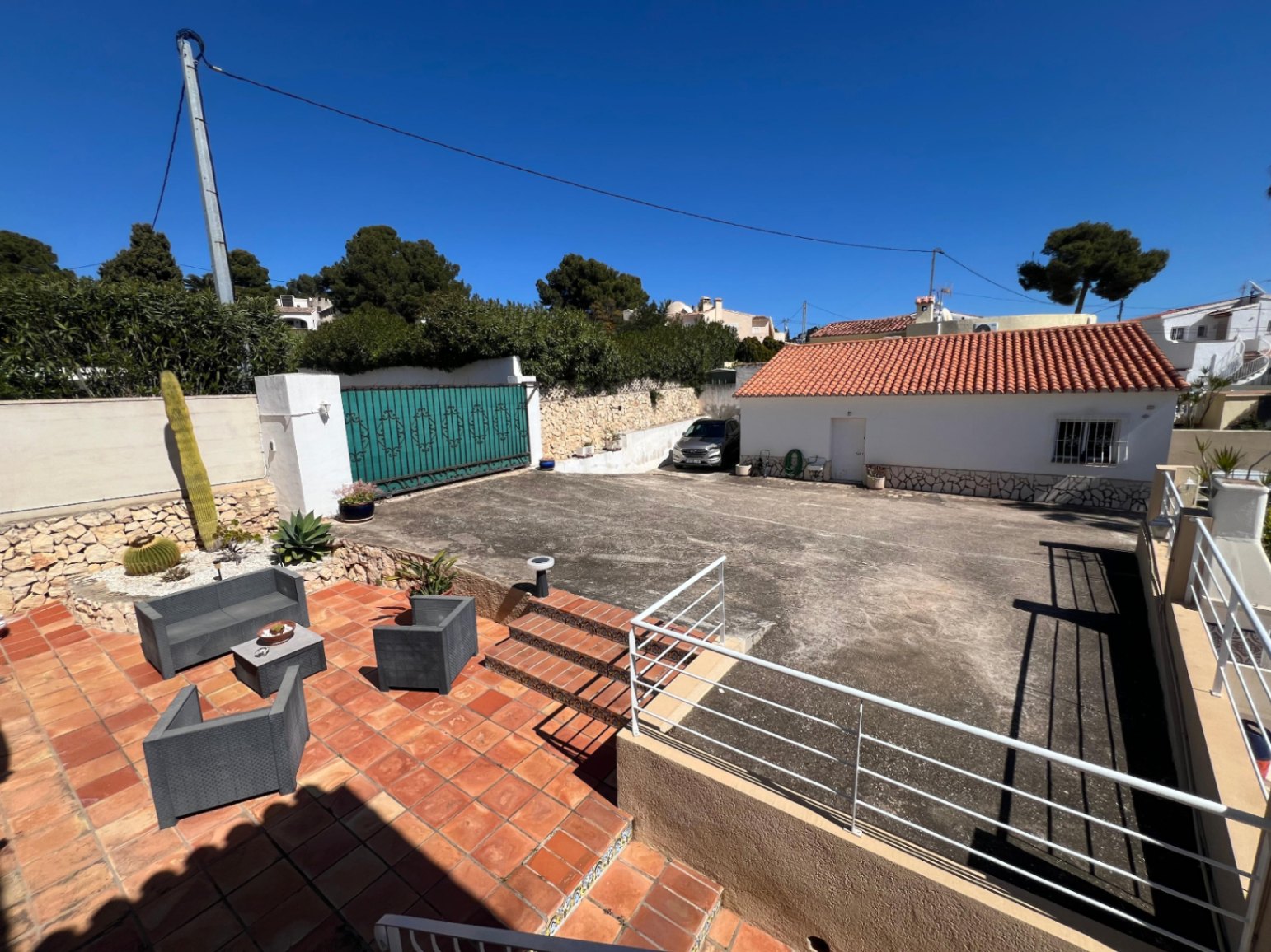Outdoor terrace and driveway area at Mediterranean villa in Benissa