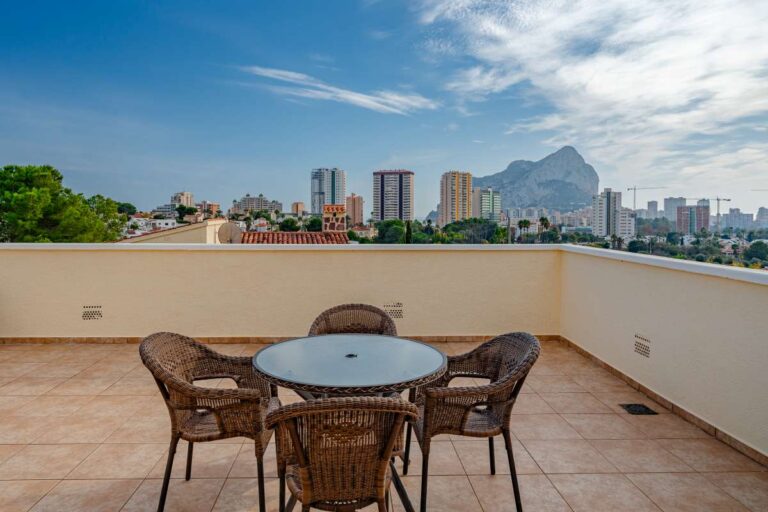 Outdoor terrace at a villa in Calpe with dining area and views towards the Peñón de Ifach