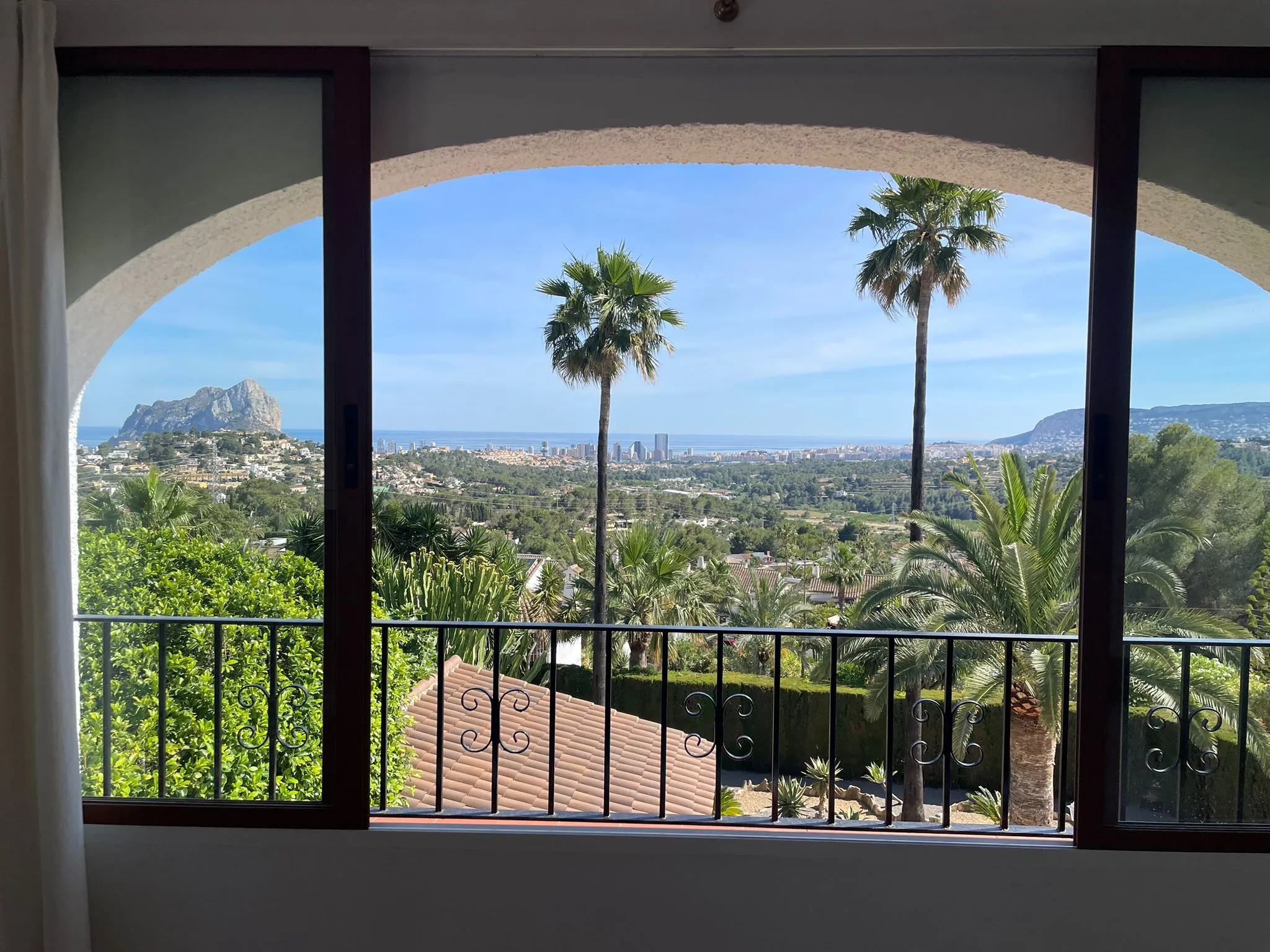 Panoramic sea views and Peñón de Ifach views from the master bedroom lounge area in a Calpe villa.
