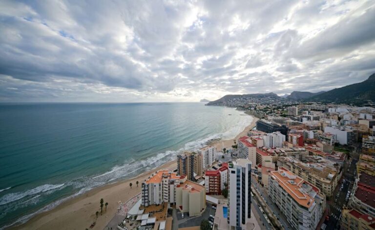 Panoramic sea views from a renovated apartment by Arenal-Bol Beach in Calpe overlooking the beach, coastline and Mediterranean Sea