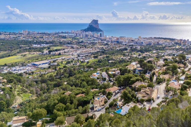 Panoramic views across Calpe towards the Peñón de Ifach from a modern spacious villa with sea views.