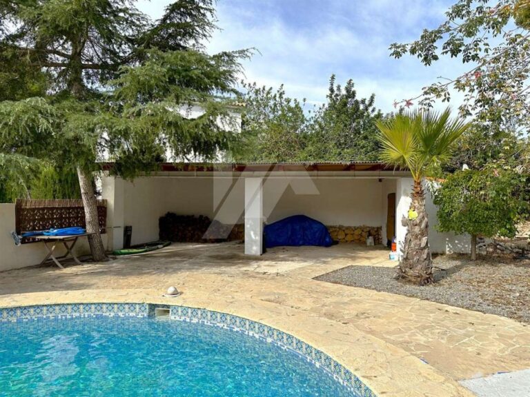 Pool area at a single-level villa near El Portet Beach in Moraira with private swimming pool, covered outdoor area and Mediterranean garden