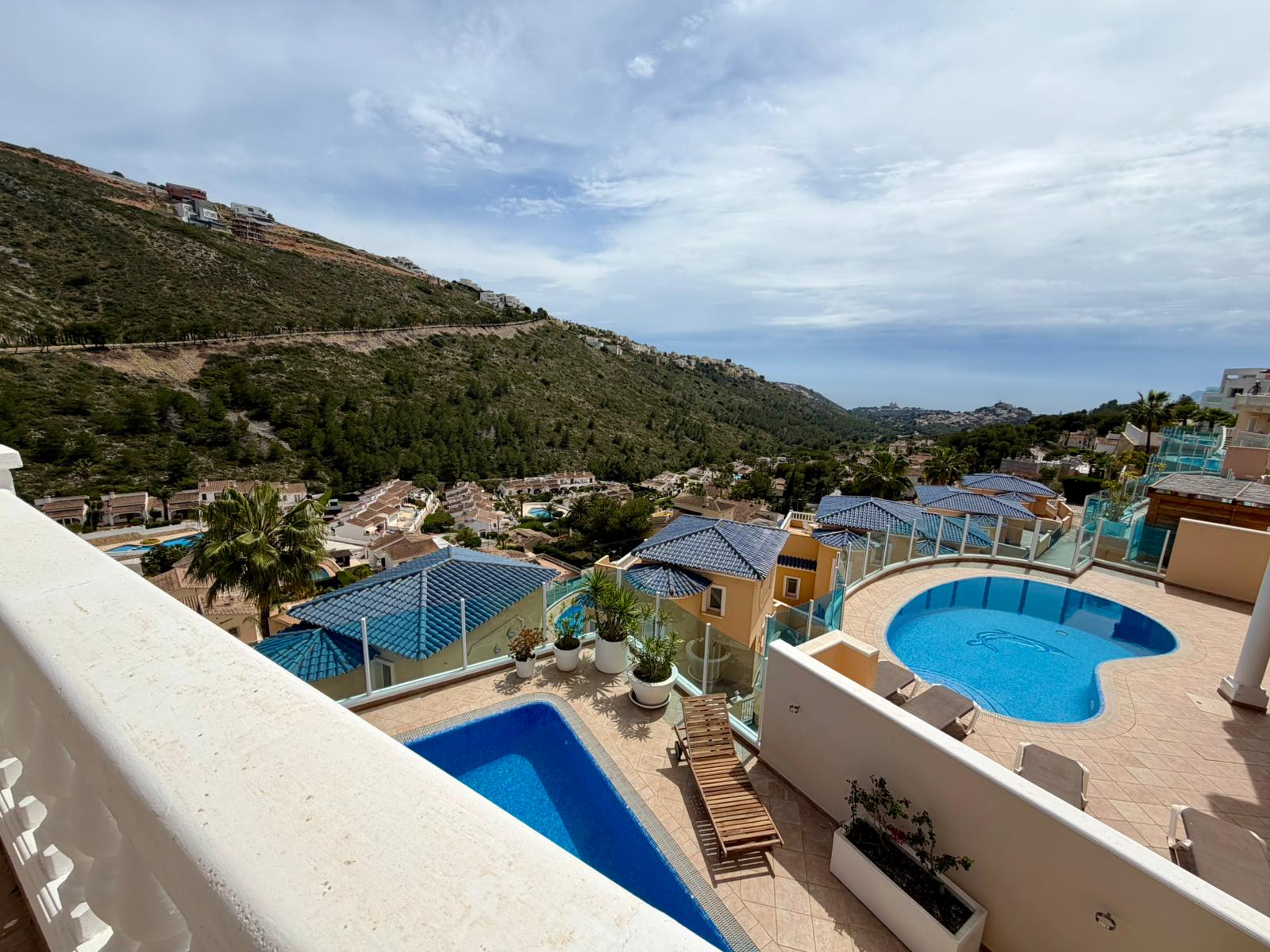 Pool area with sea and Portet valley views at modern villa in Moraira