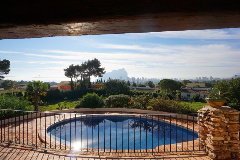 Pool terrace at a Mediterranean villa in Calpe with sea views, garden surroundings and views towards the Peñón de Ifach