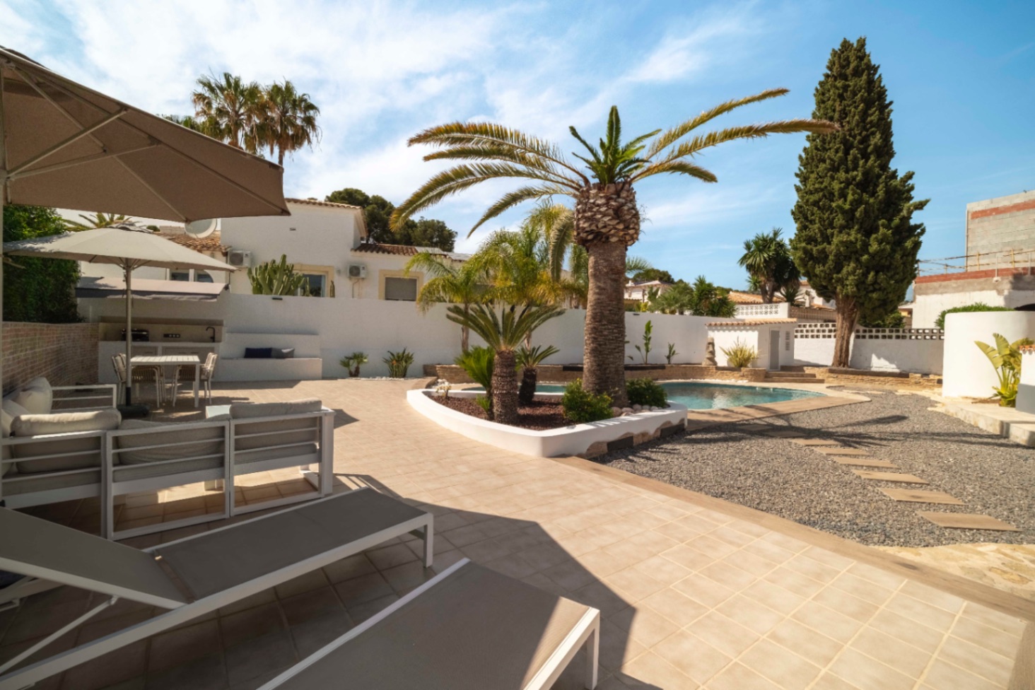 Pool terrace with outdoor seating at Ibiza-style villa in Calpe