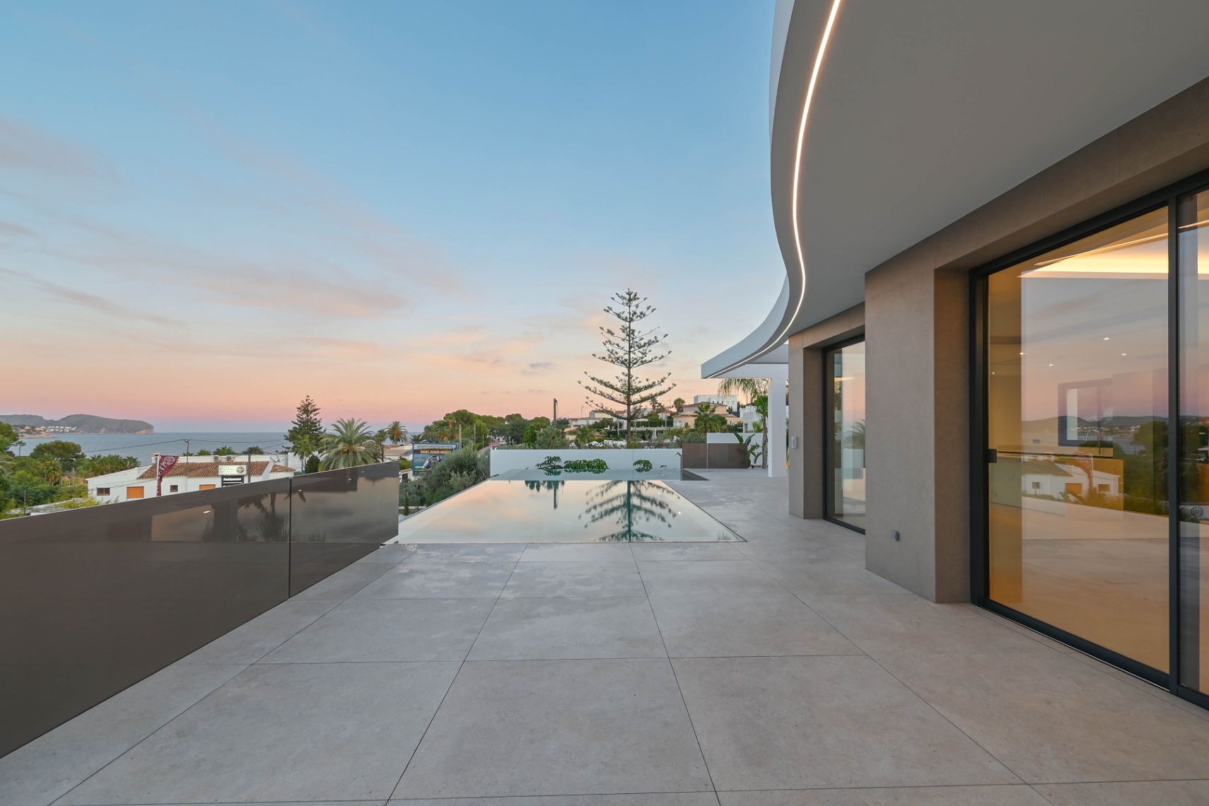 Pool terrace with sea views at newly built villa near La Fustera Beach