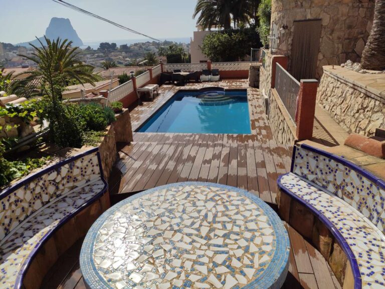Pool terrace with views towards the Peñón de Ifach at a refurbished villa with three independent apartments in Canuta, Calpe.