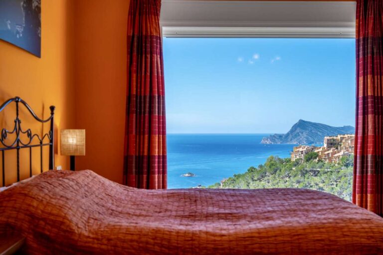 Principal bedroom inside an elegant Mediterranean villa in Altea Hills with panoramic sea views, views towards Albir and terrace access