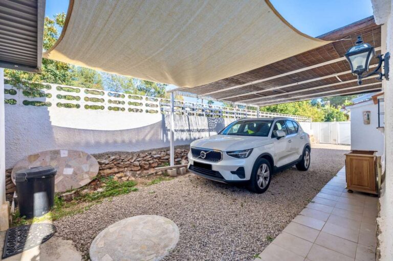 Private garage access and covered parking area at a contemporary villa in a peaceful residential area of Calpe.