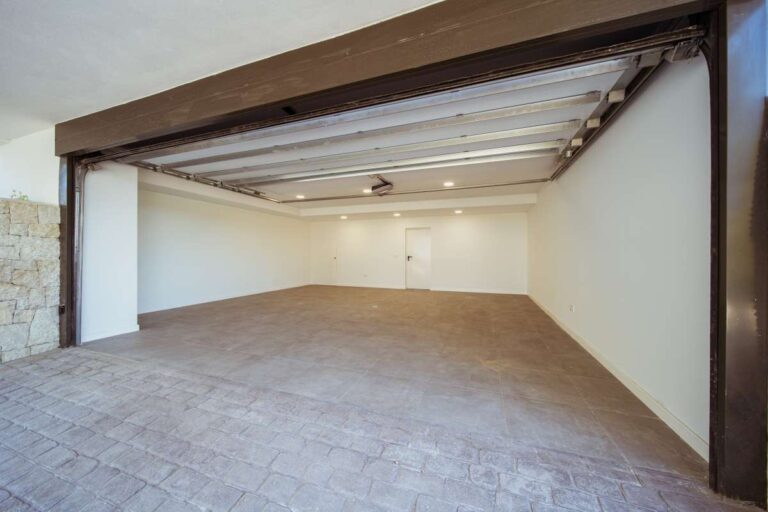 Private garage at a new-build luxury villa in Moraira with spacious covered parking and modern tiled finish
