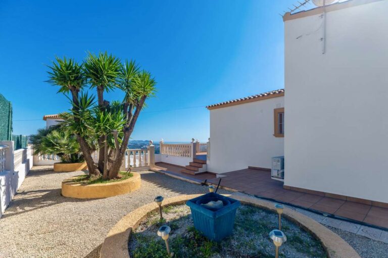 Private garden and terrace area with Mediterranean plants at a villa in Calpe.