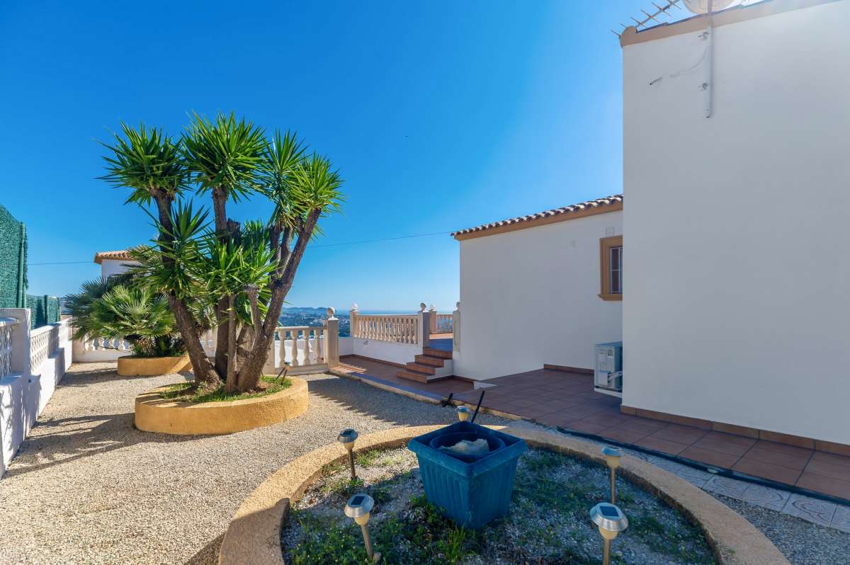 Private garden and terrace area with Mediterranean plants at a villa in Calpe.