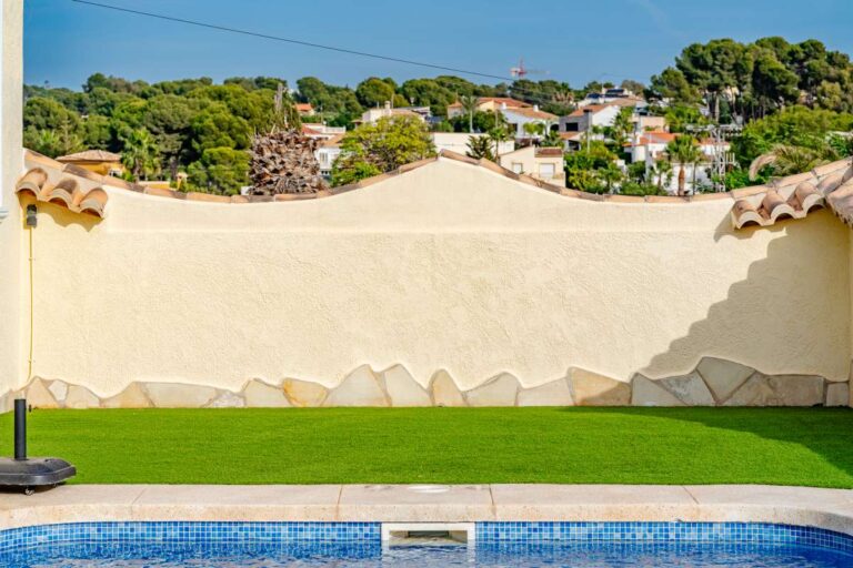 Private pool terrace at a villa in Calpe with garden area and surrounding residential views