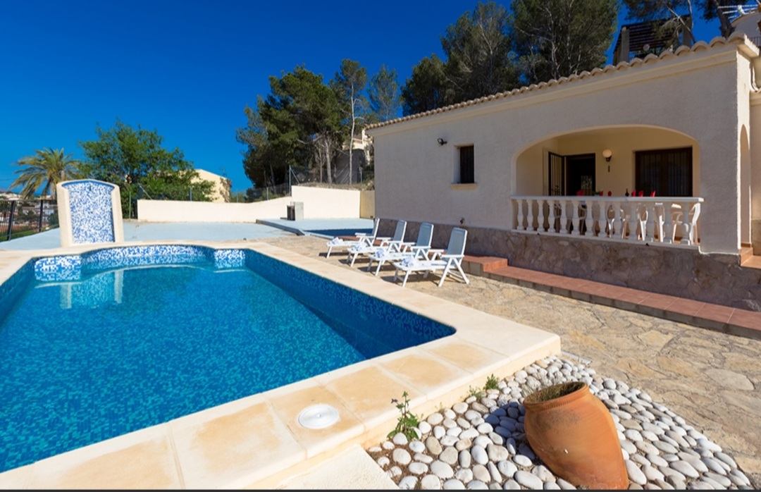 Private swimming pool and sun terrace at a Mediterranean villa with mountain views in Calpe.