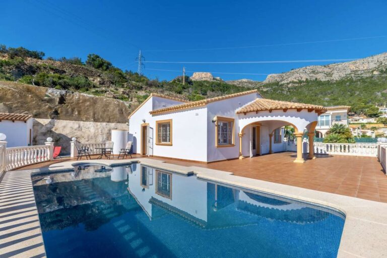 Private swimming pool and terrace with sea views at a villa in Calpe.