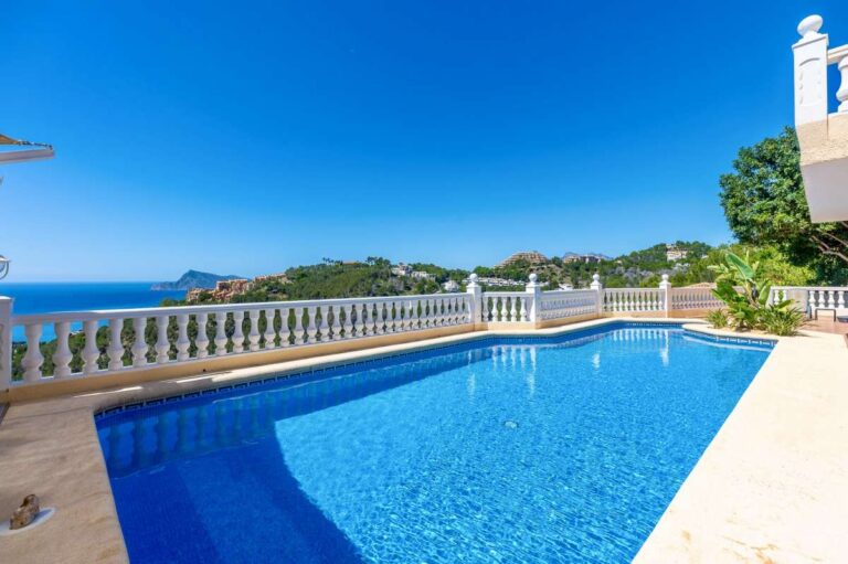 Private swimming pool at an elegant Mediterranean villa in Altea Hills with panoramic sea views, terrace space and balustrade surround