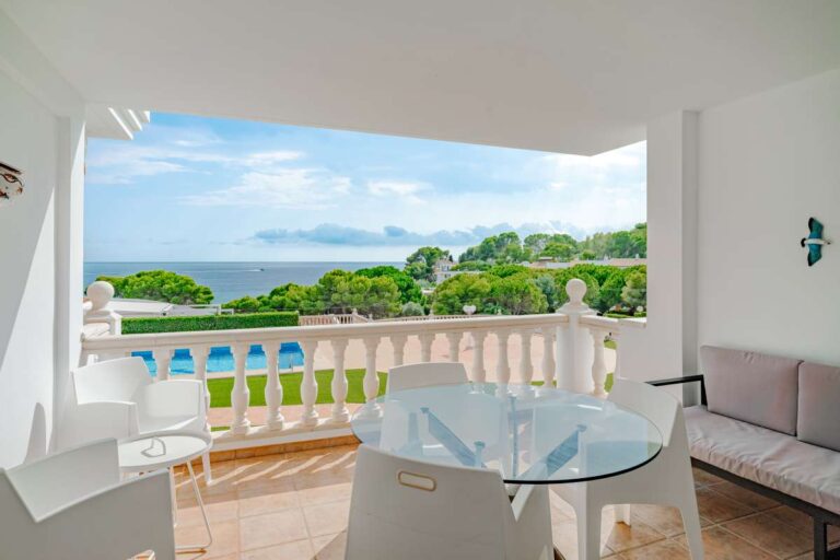 Private terrace at a duplex apartment near Les Platgetes Beach in Moraira with sea views, outdoor dining area and communal garden views