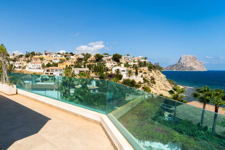 Private terrace at a luxury villa in Calpe with glass balustrades, panoramic sea views and views towards the Peñón de Ifach