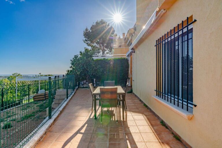 Private terrace at a semi-detached house in Calpe with outdoor dining area, sea views and mountain views in the distance