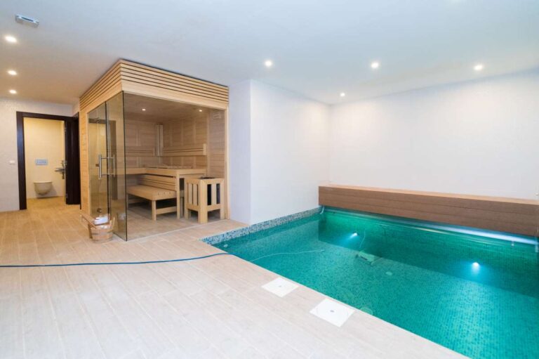 Private wellness area inside a luxury villa in Calpe with indoor plunge pool, sauna and bright spa-style finish