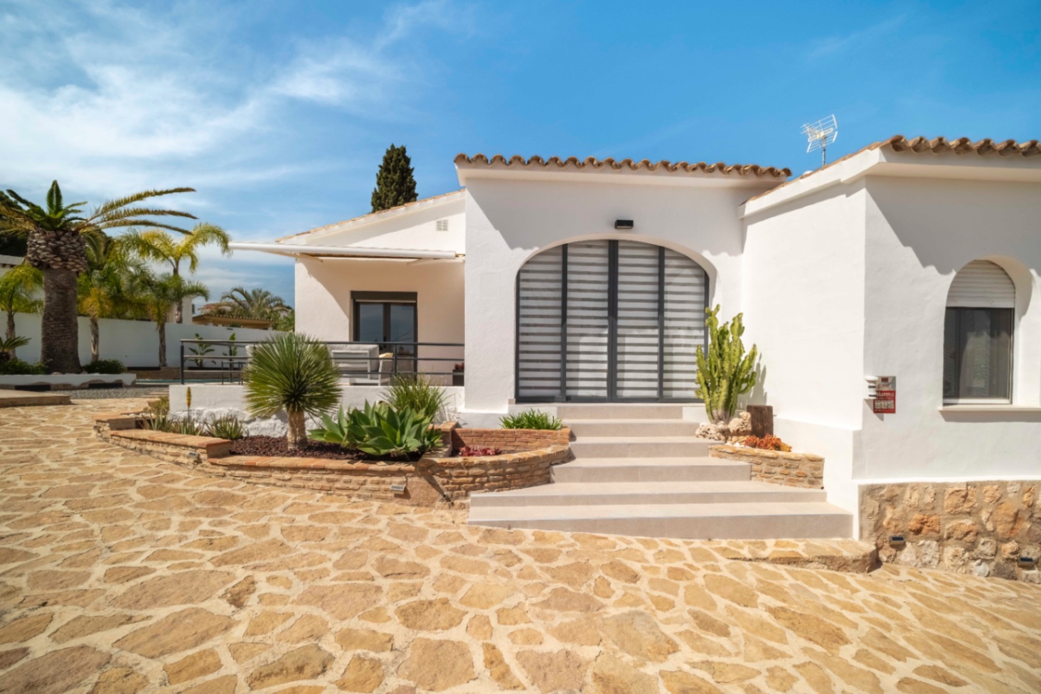Renovated Ibiza-style villa entrance and exterior in Calpe