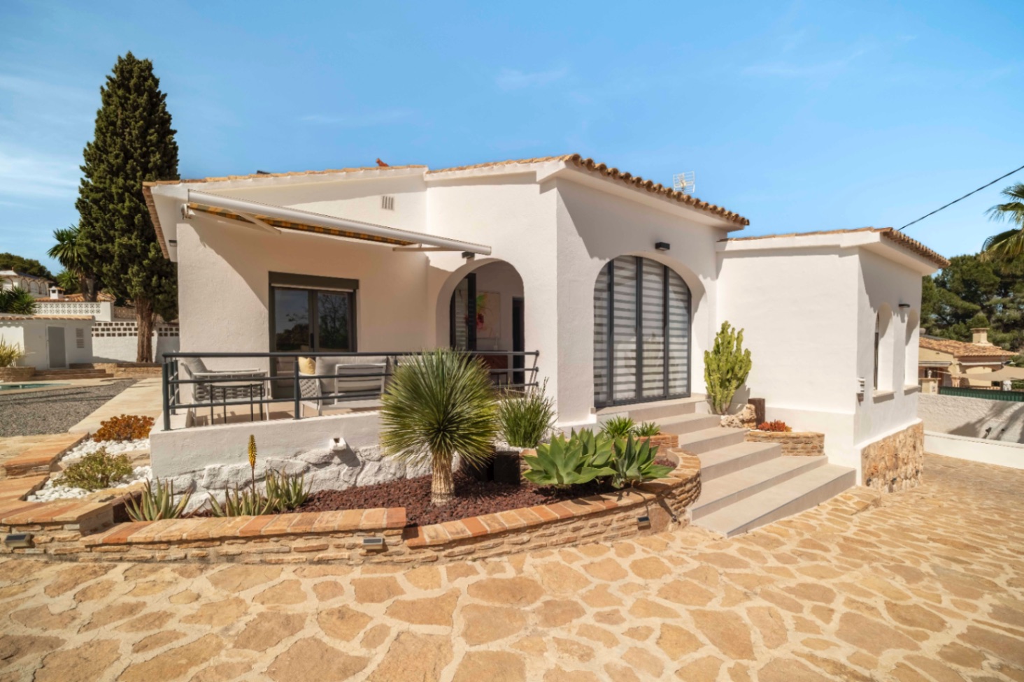 Renovated Ibiza-style villa exterior with terrace in Calpe