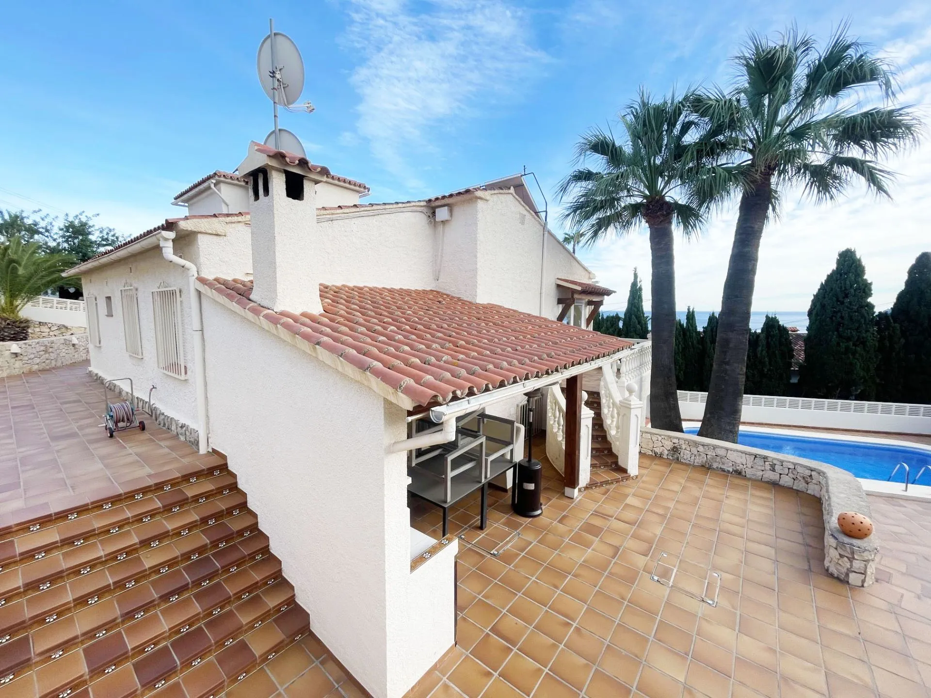 Renovated villa exterior with private pool and summer kitchen in Calpe