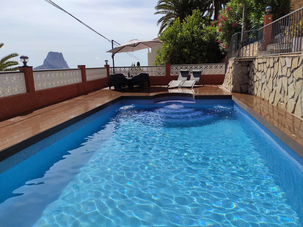 Salt water swimming pool with terrace and views towards the Peñón de Ifach at a villa in Canuta, Calpe.