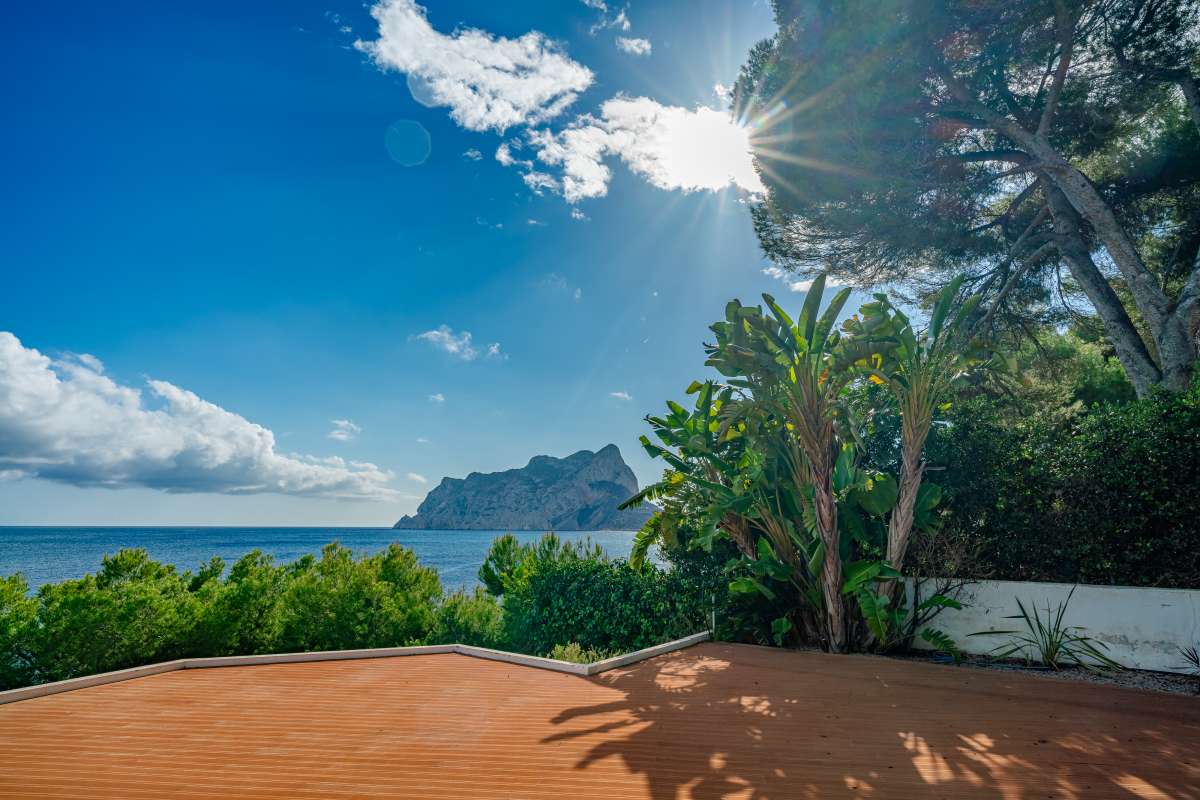 Sea view terrace with Mediterranean planting at a frontline villa in Les Bassetes, Benissa Coast.