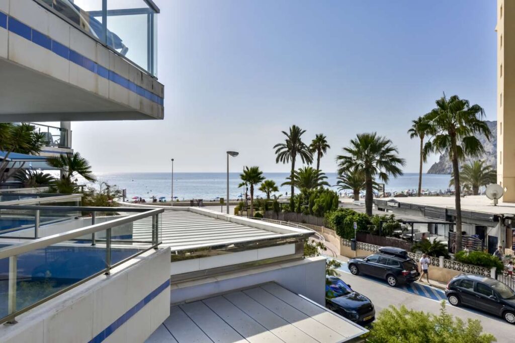 Sea views from a frontline apartment in La Fossa, Calpe with palm trees, nearby beach and coastal promenade