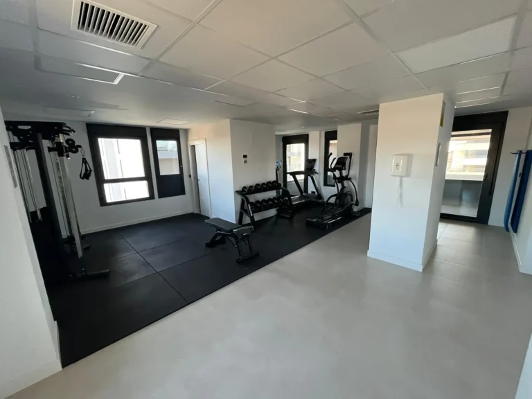 Shared gym and wellness area at modern penthouse complex in Calpe