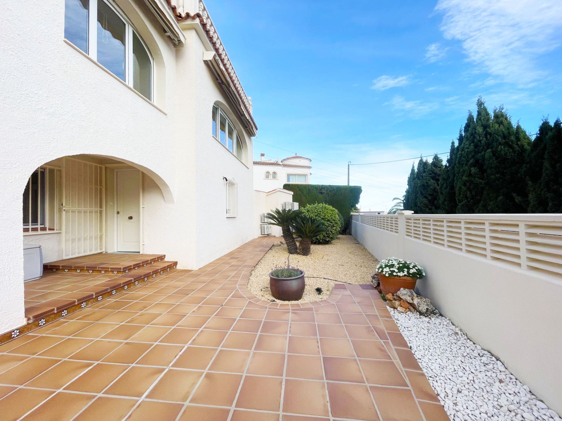 Side terrace and low-maintenance garden at renovated villa in Calpe