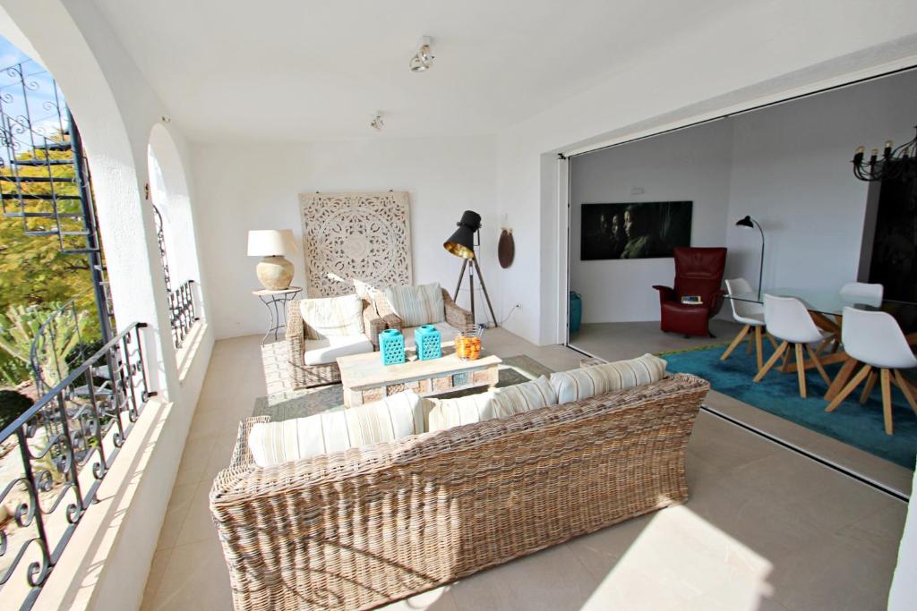 Spacious covered terrace with outdoor seating at south-facing Moraira villa