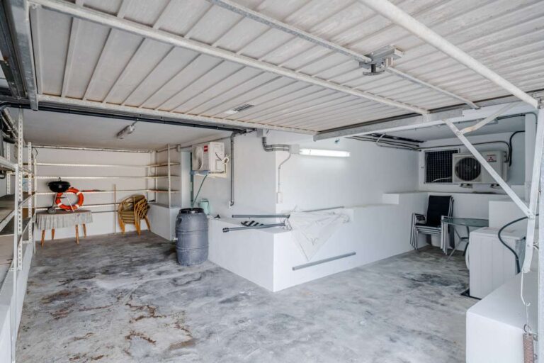 Spacious garage and storage area at a villa in Calpe with parking space and utility area