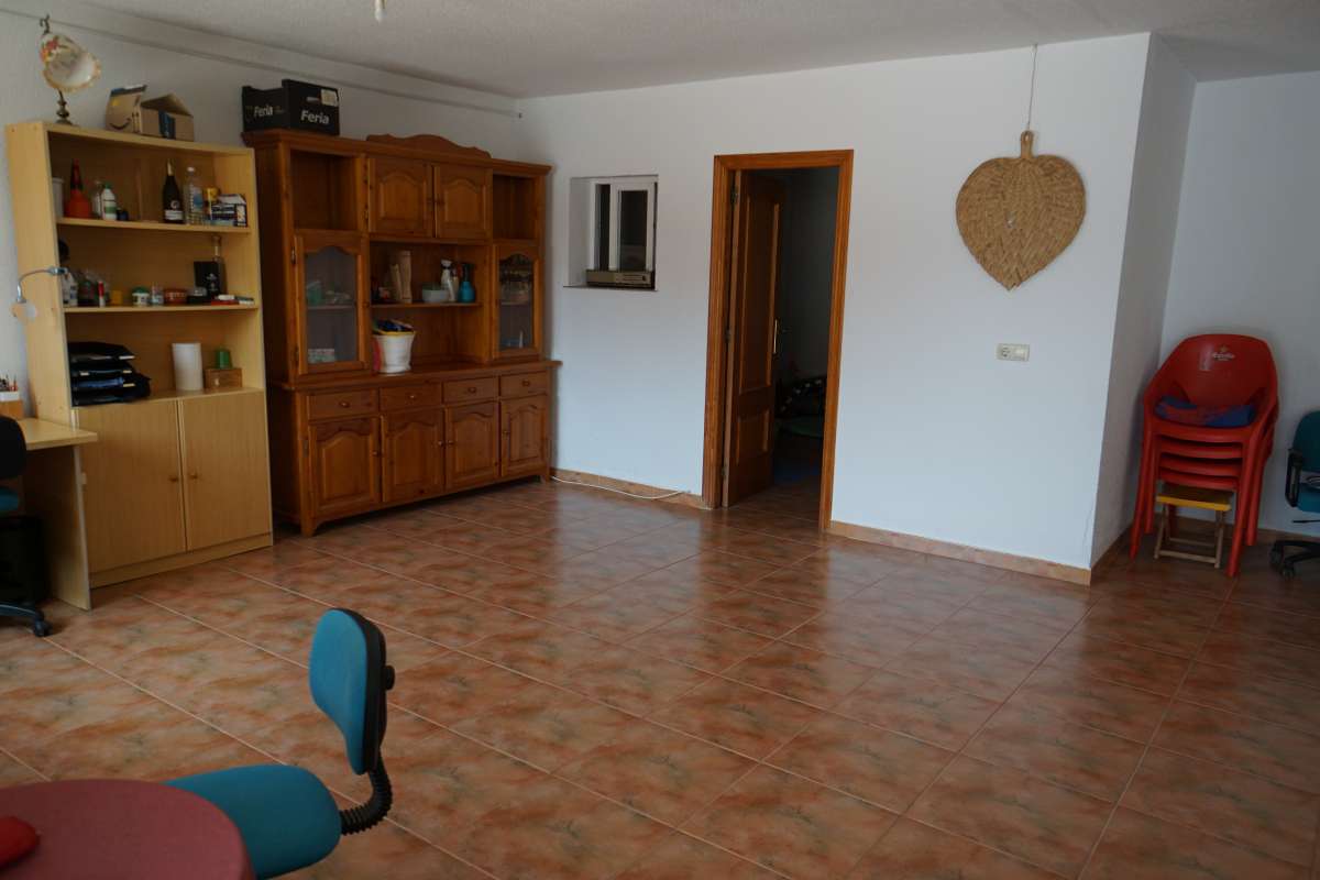 Spacious living area with traditional wooden furniture inside a Mediterranean villa in Calpe.