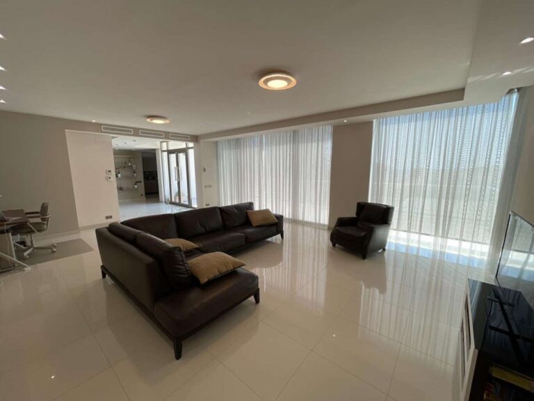 Spacious living room inside a modern luxury villa in La Calalga, Calpe with large windows, sofa seating and bright contemporary interior