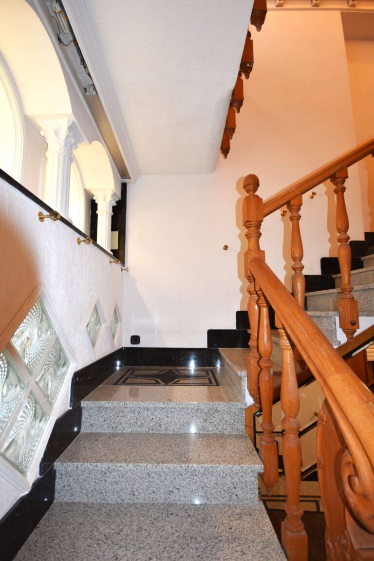 Staircase access to the upper apartment inside a frontline double penthouse for sale on Arenal Beach in Calpe.