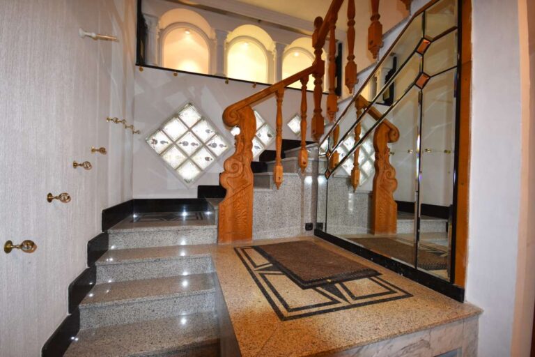Staircase leading to the upper apartment inside a frontline double penthouse on Arenal Beach in Calpe.