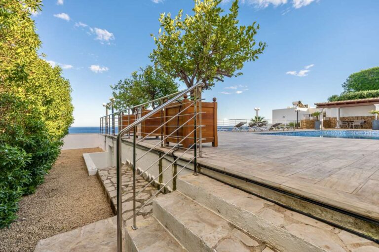 Steps leading to the pool terrace at a premium coastal villa on the Benissa Costa with sea views and spacious outdoor terrace