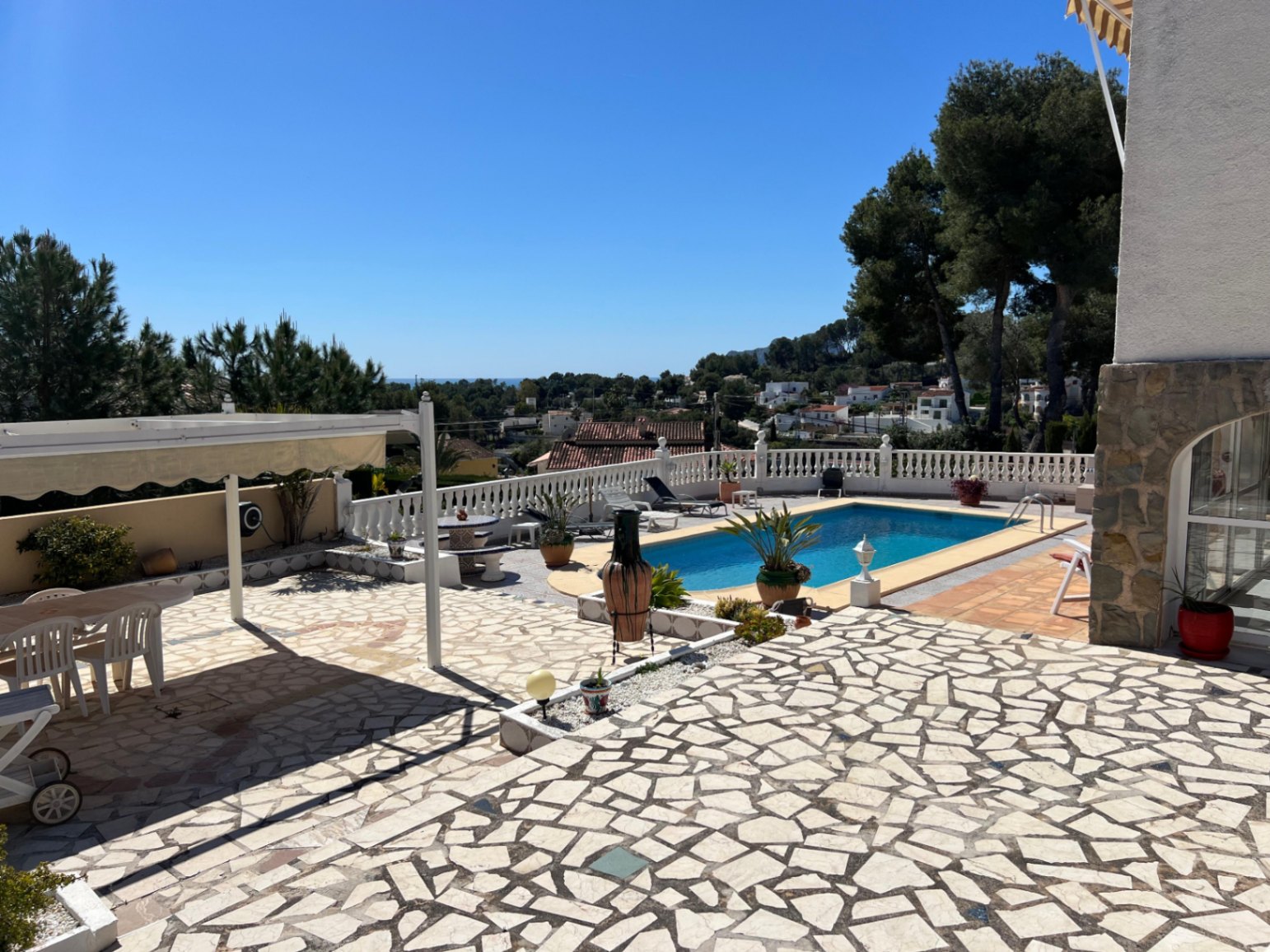 Stone terrace beside private pool at villa in Buena Vista Benissa