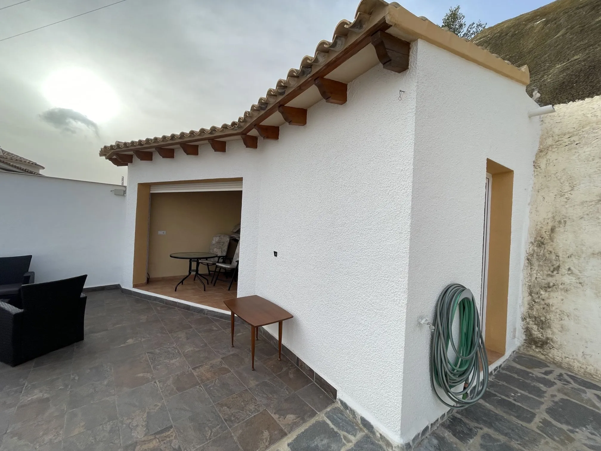 Storage building beside patio at detached villa in Calpe