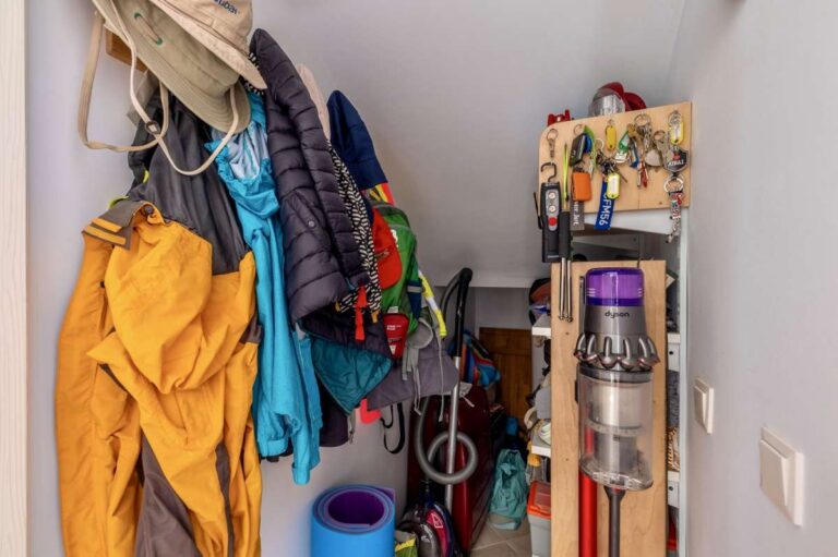 Storage room with household equipment inside a contemporary villa in Calpe with garage and laundry space.