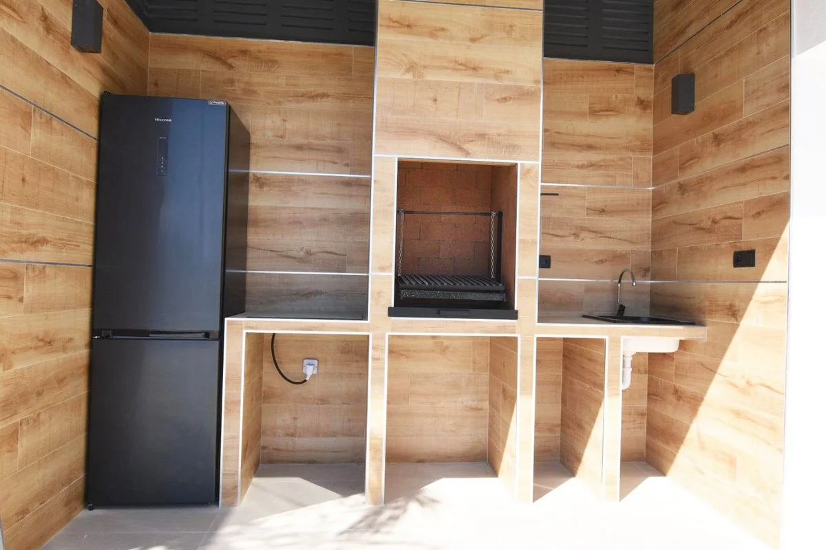 Summer kitchen with barbecue area at modern villa in Calpe