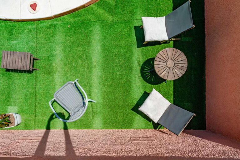 Sun lounging area with artificial grass beside the private pool at a renovated Mediterranean villa in La Cometa, Calpe.