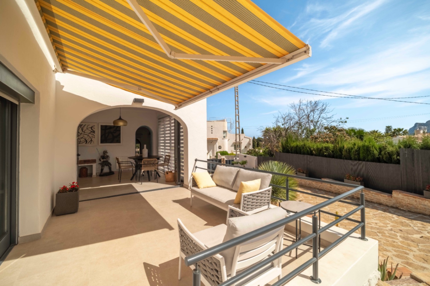 Sunny terrace with awning at south-facing villa in Calpe