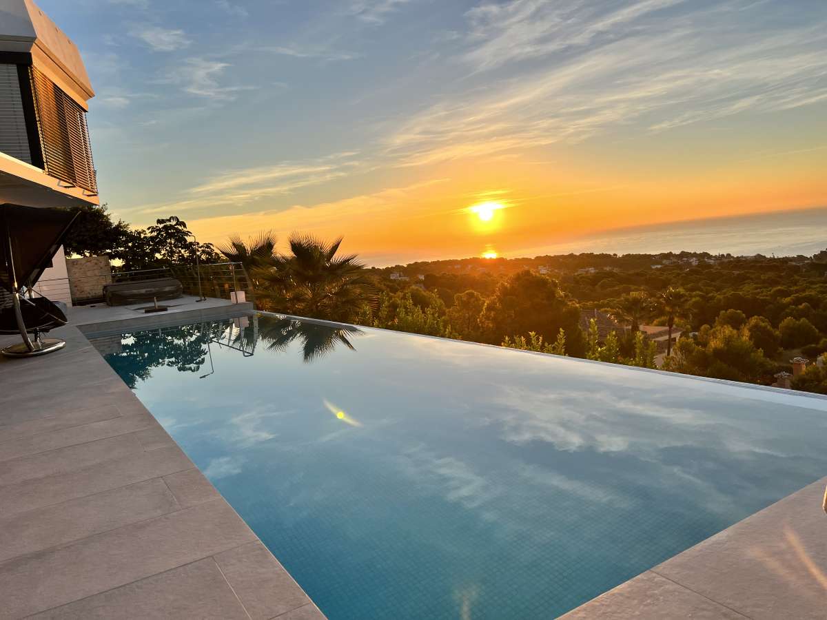 Sunset views from the infinity pool terrace at a luxury villa with panoramic sea views in Gran Sol, Calpe.
